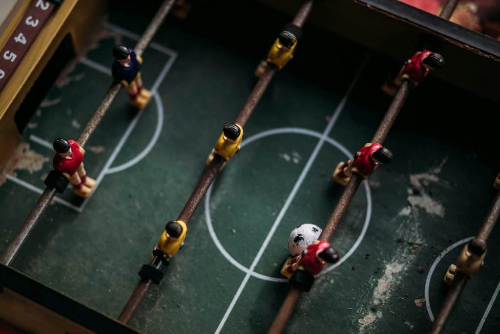 Table foosball game representing the fun and competitive spirit of the Best Soccer Players of The 80’s