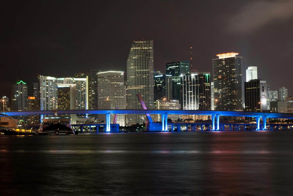 Miami skyline at night, representing the home of the best Miami basketball players.