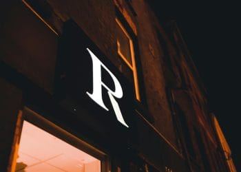 Black and white photo of an NBA player about to perform a crossover dribble, representing the Top 10 Best NBA Players First Names That Start With R