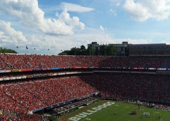 A packed stadium of Georgia Bulldogs fans, celebrating the legacy of the 10 Best Georgia Players in the NFL.