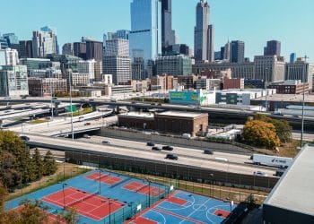 Basketball courts with a city skyline backdrop, representing the legacy of the Best ACC Basketball Players of All Time.