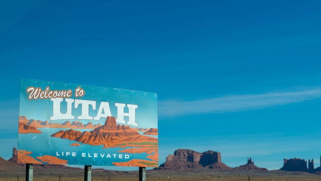 Welcome to Utah sign against a desert landscape, symbolizing the home state of the Best Utah Football Players of All Time.