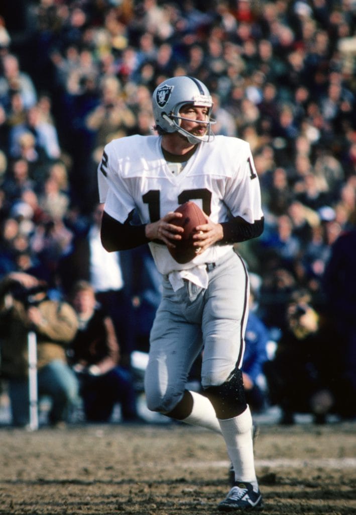 Ken Stabler of the Oakland Raiders preparing to pass the football during a game.