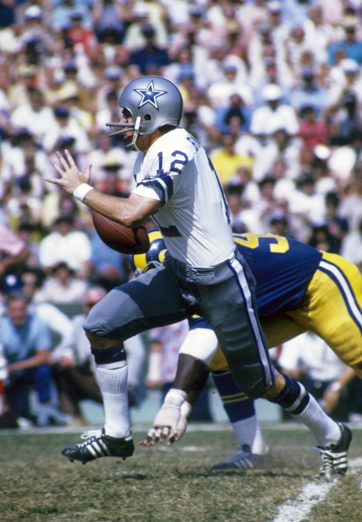 Roger Staubach of the Dallas Cowboys running with the football during a game against the Los Angeles Rams.