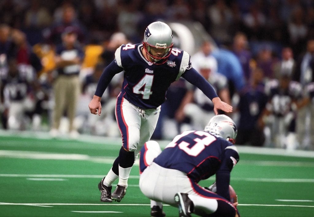 Adam Vinatieri of the New England Patriots preparing to kick during a crucial Super Bowl moment