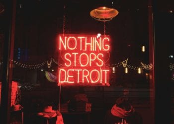Neon sign reading "Nothing Stops Detroit," symbolizing the resilience of the city and the impact of the best Detroit Lions players.