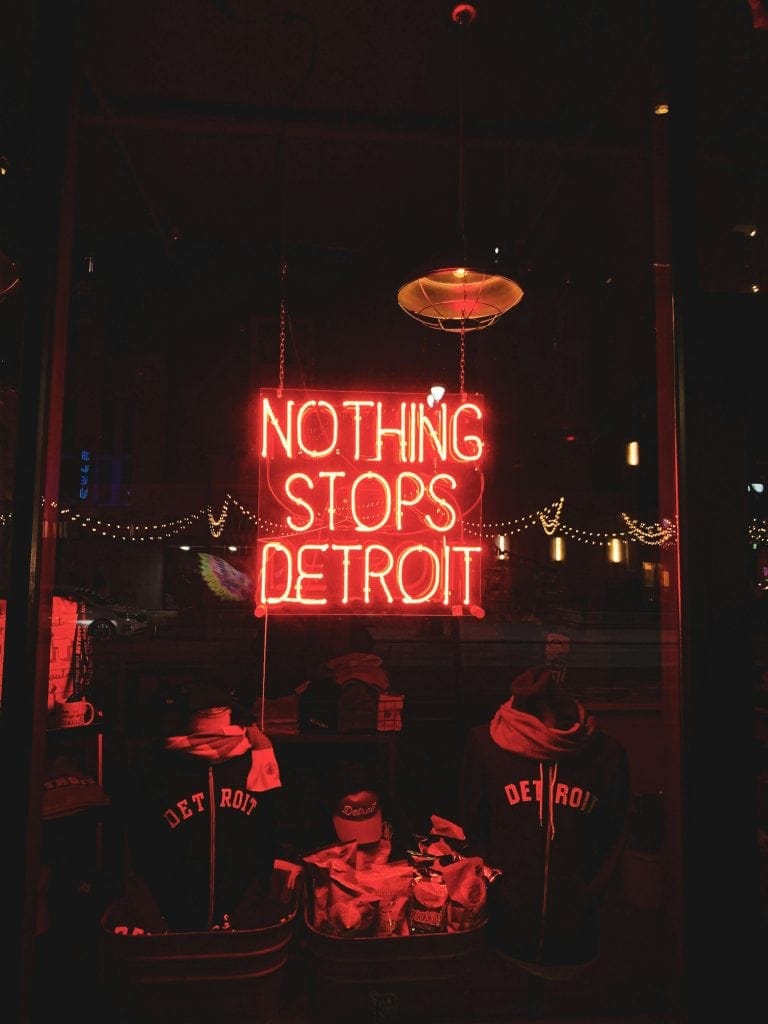 Neon sign reading "Nothing Stops Detroit," symbolizing the resilience of the city and the impact of the best Detroit Lions players.