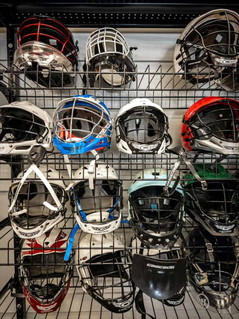 A collection of lacrosse helmets, symbolizing the toughness and skill of the best NLL players of all time who shaped professional lacrosse history.