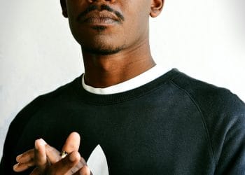 New Orleans Saints fan wearing a Saints cap, representing the passion for the best Saints players of all time who defined the team’s legacy.