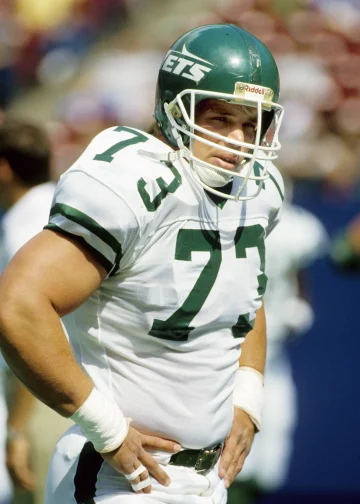 Joe Klecko standing on the field with an intense game face during his time with the New York Jets.