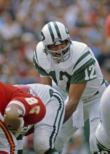 Joe Namath under center during a New York Jets game, calling a play