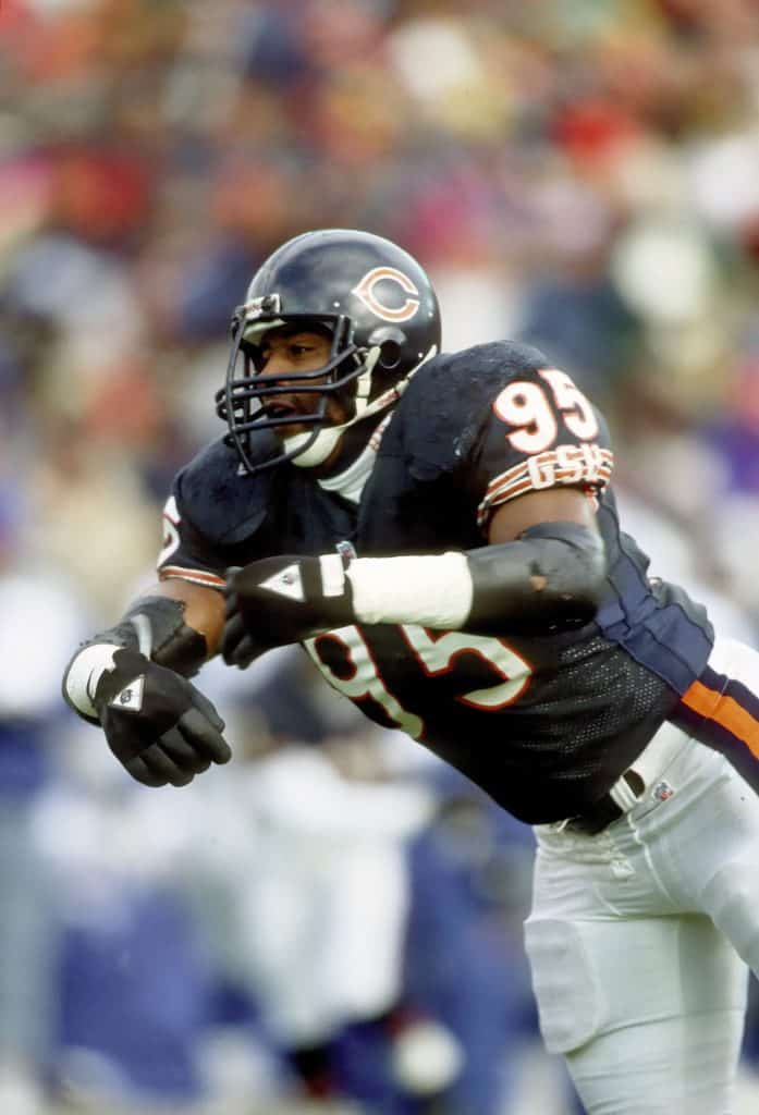 Chicago Bears linebacker Richard Dent in action, wearing the iconic navy blue Bears uniform.