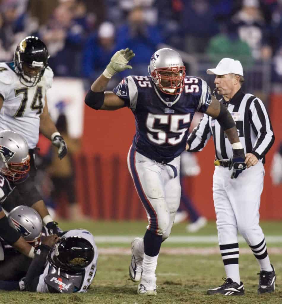Willie McGinest celebrating after making a defensive play for the New England Patriots in a game against the Jacksonville Jaguars.