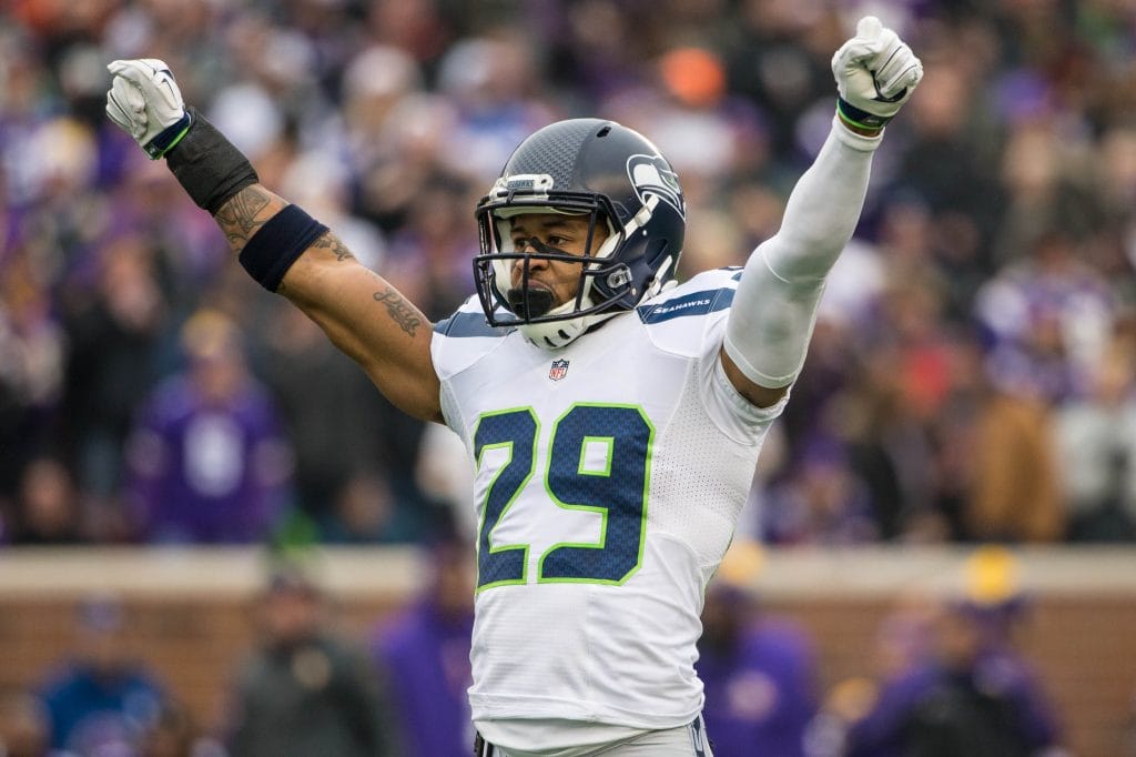 Earl Thomas of the Seattle Seahawks raises his arms in celebration during an NFL game.