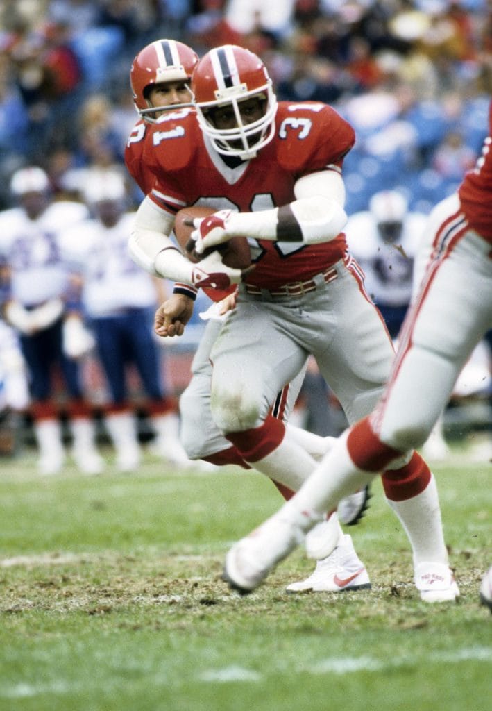 William Andrews running back for the Atlanta Falcons, carrying the football during a game.