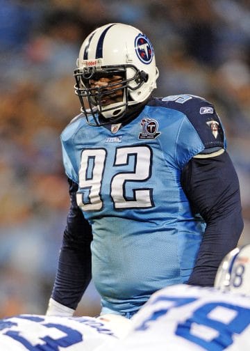 Albert Haynesworth, Tennessee Titans defensive lineman, focuses before a snap during an NFL game.