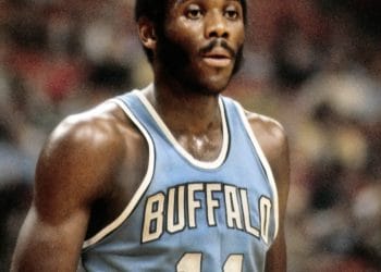 Buffalo Braves Best Players: Close-up of Bob McAdoo in a classic light blue Buffalo Braves jersey, representing one of the team's greatest players.
