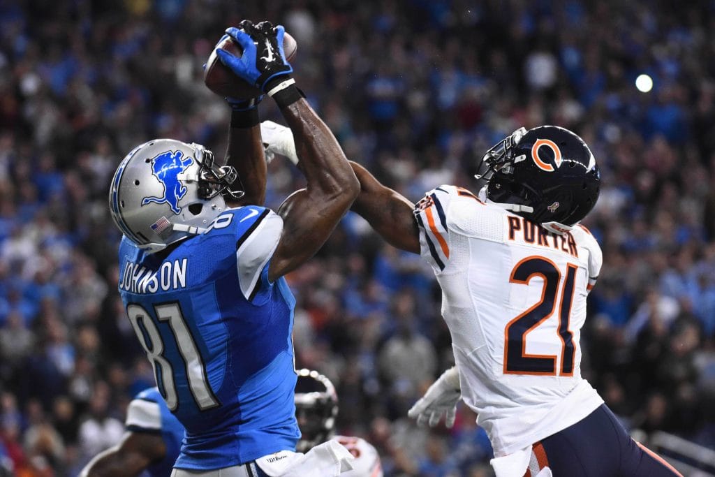 Calvin Johnson makes a contested catch against a Chicago Bears defender.