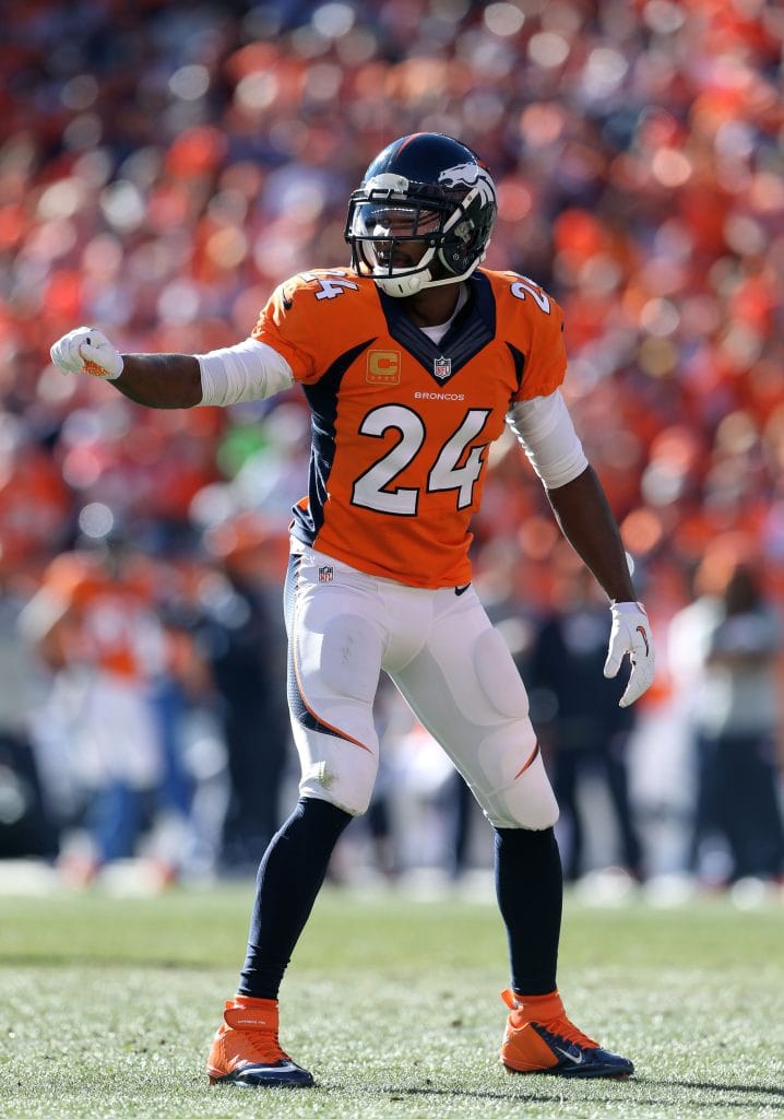 Champ Bailey of the Denver Broncos signals to teammates during a defensive play.