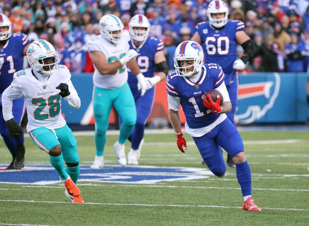 Cole Beasley running a punt return in his Buffalo Bills uniform during a game against the Miami Dolphins.