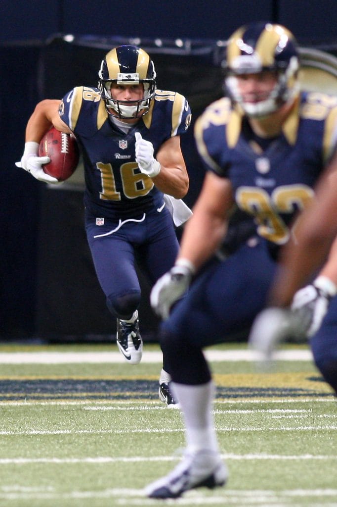 Danny Amendola returning a punt in his St. Louis Rams uniform during a home game.