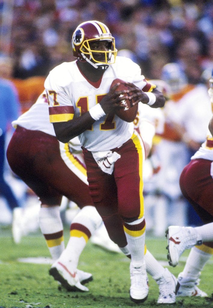 Doug Williams of the Washington Redskins drops back to pass during the Super Bowl.
