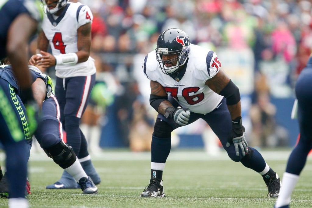 Houston Texans offensive lineman Duane Brown in a blocking stance during a game.