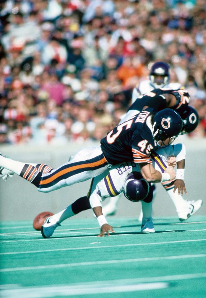 Gary Fencik delivering a hard tackle for the Chicago Bears, one of the top white strong safeties in NFL history.