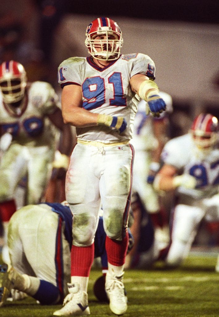 Jeff Wright, one of the best white NFL players, lines up during a Buffalo Bills game, anchoring the defensive line.