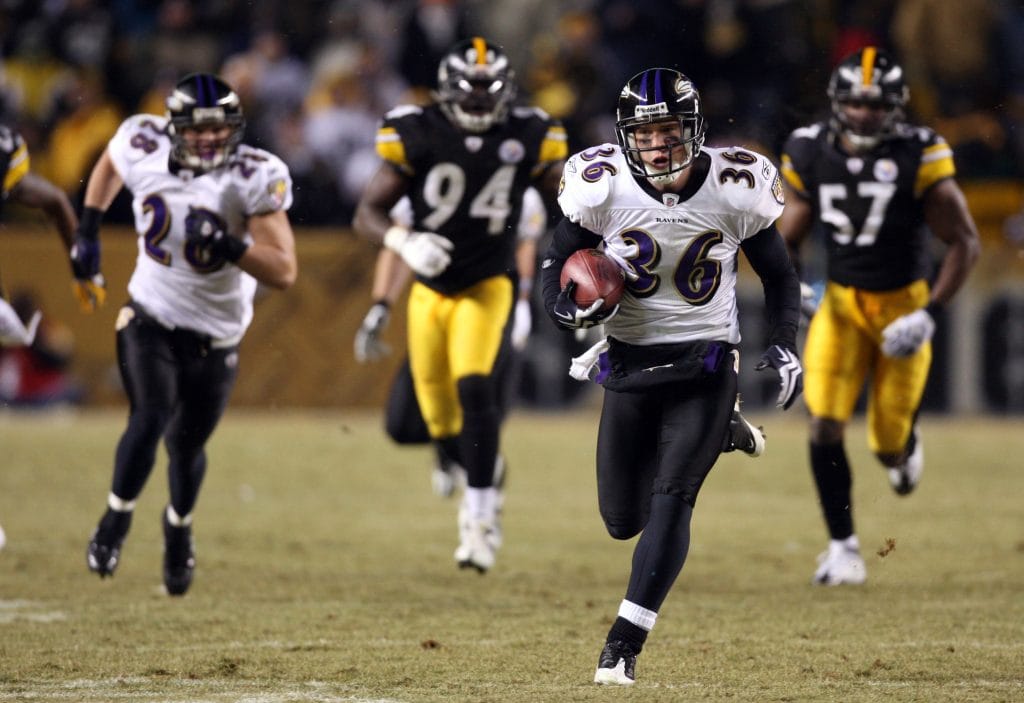 Jim Leonhard, a famous white football player, returning an interception for the Baltimore Ravens.