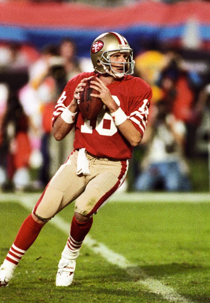 Joe Montana, number 16, prepares to throw a pass during a Super Bowl for the San Francisco 49ers.