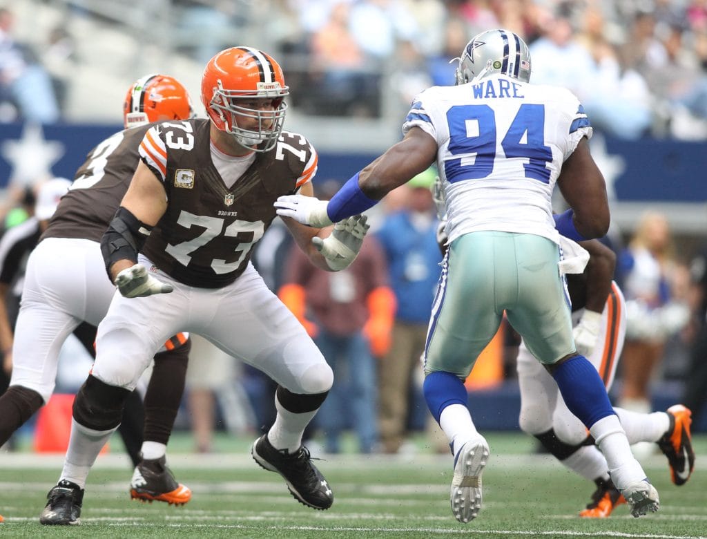 Joe Thomas blocking DeMarcus Ware during a game, representing one of the Top 10 White Left Tackles of All Time.
