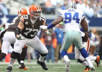 Joe Thomas blocking DeMarcus Ware during a game, representing one of the Top 10 White Left Tackles of All Time.