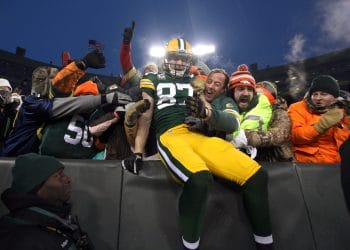 Jordy Nelson, one of the best white NFL players of all time, performs a Lambeau Leap into the crowd after scoring a touchdown for the Packers.