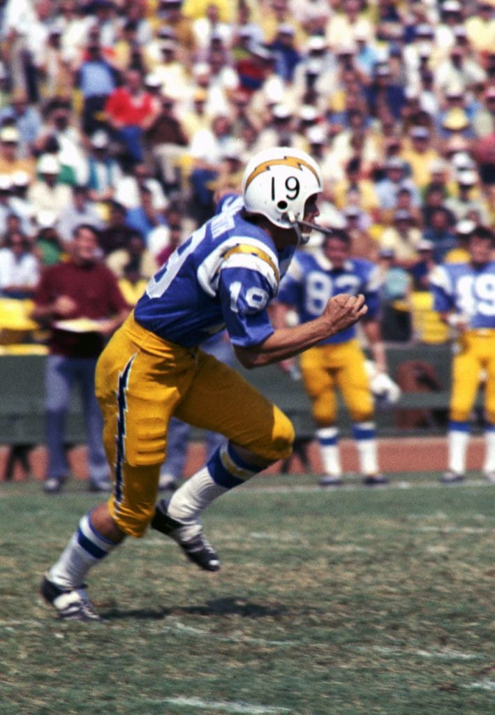 Lance Alworth, one of the most famous white football players, sprints downfield for the San Diego Chargers during a classic AFL matchup.
