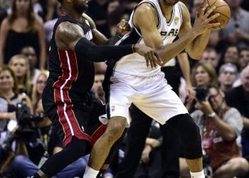 eBron James defending Tim Duncan in a high-stakes NBA Finals matchup, showcasing the intensity of two legends from the 10 Best NBA Playoff Players list.