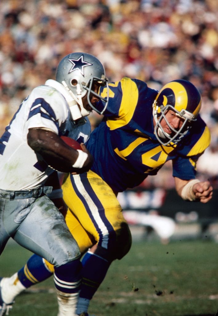 Merlin Olsen, featured in the top 10 white defensive tackles of all time, playing for the Los Angeles Rams during his Hall of Fame career.