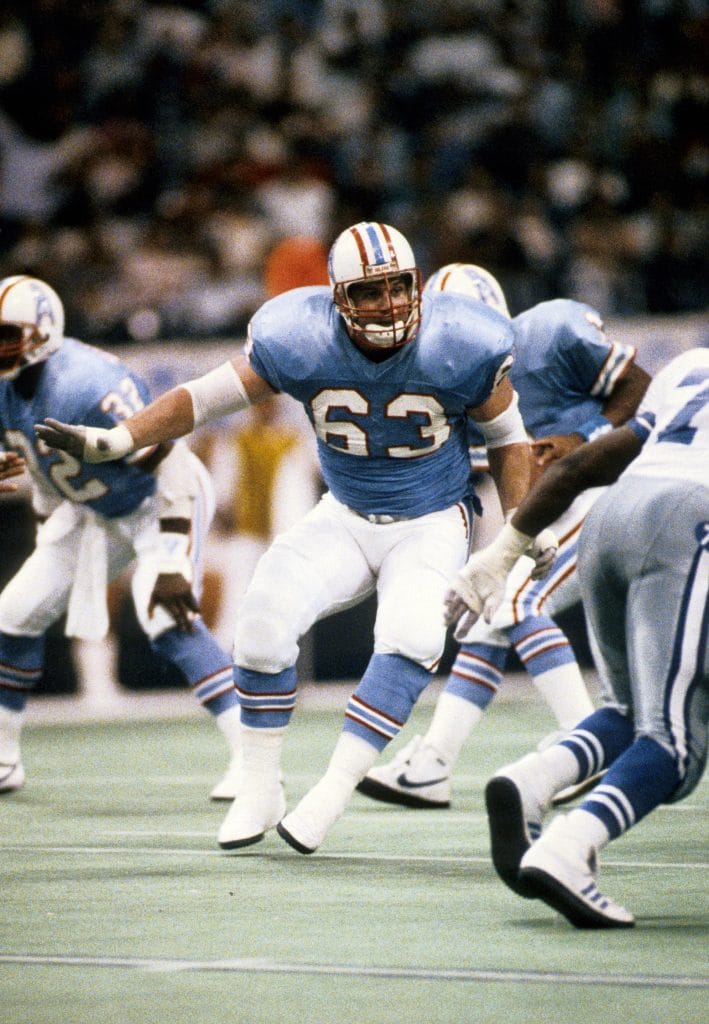 Mike Munchak blocking for the Houston Oilers, highlighting his strength as one of the great left guards in NFL history.