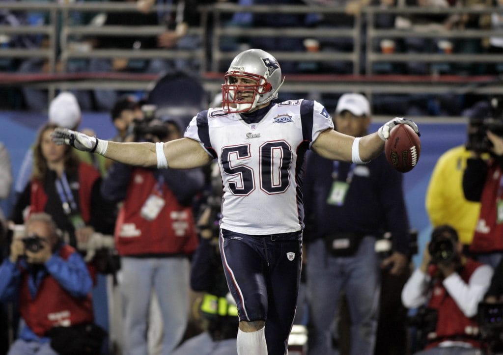 Mike Vrabel celebrating during the Super Bowl in his New England Patriots uniform.