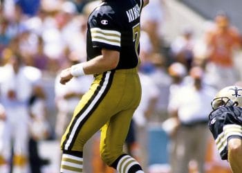 Morten Andersen kicking for the New Orleans Saints during a game, featured in the list of top 10 white kickers of all time.