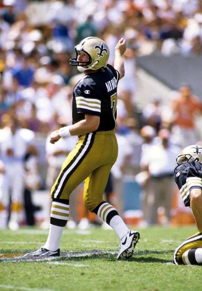 Morten Andersen kicking for the New Orleans Saints during a game, featured in the list of top 10 white kickers of all time.