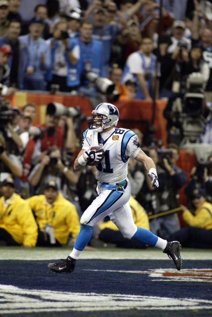 Ricky Proehl making a clutch catch, etching his name as one of the famous white football players in the league.