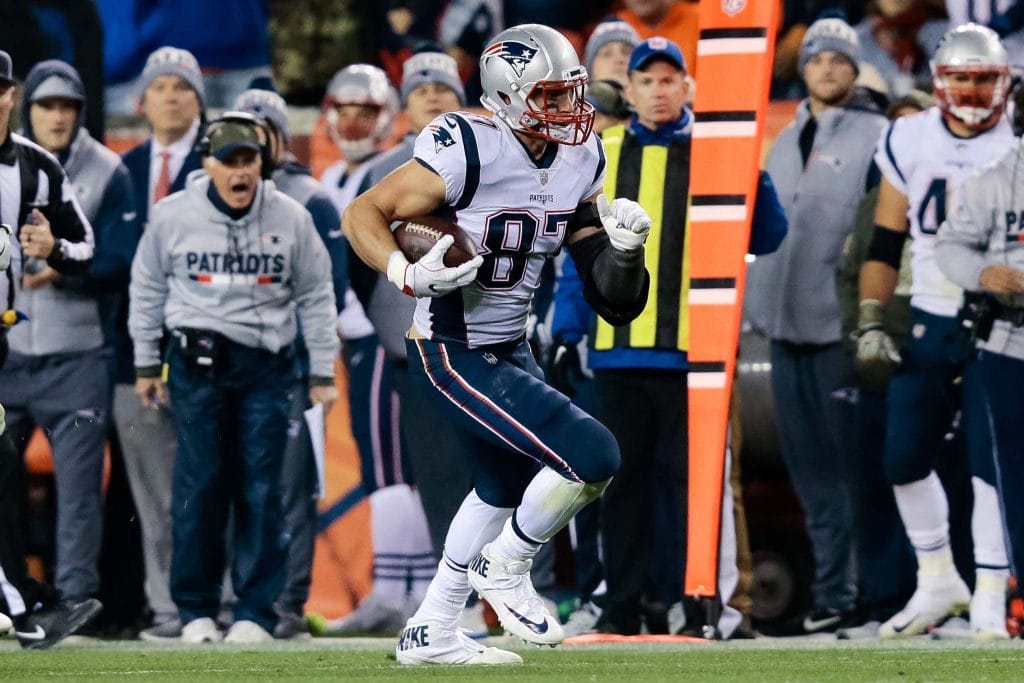 New England Patriots tight end Rob Gronkowski runs with the football during a game.