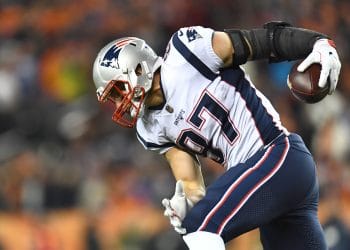 Rob Gronkowski celebrates a touchdown catch in a New England Patriots game, one of the Top 10 White Tight Ends of All Time.