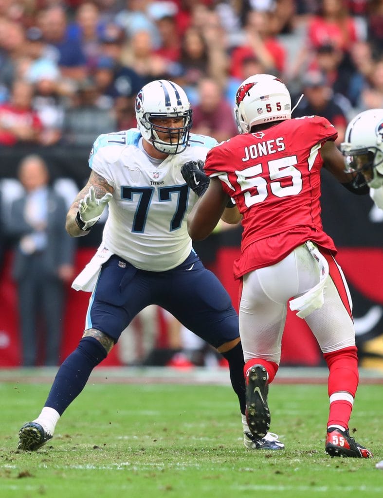 Taylor Lewan blocking during a Tennessee Titans game against the Arizona Cardinals.