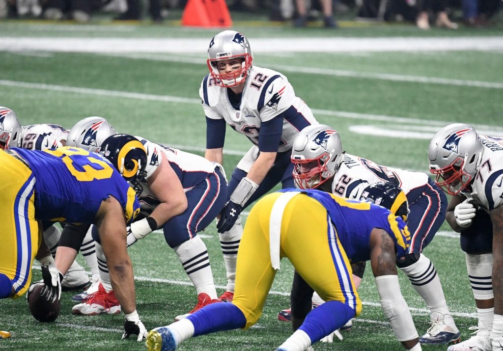 New England Patriots quarterback Tom Brady preparing for a snap against the Los Angeles Rams in Super Bowl LIII.
