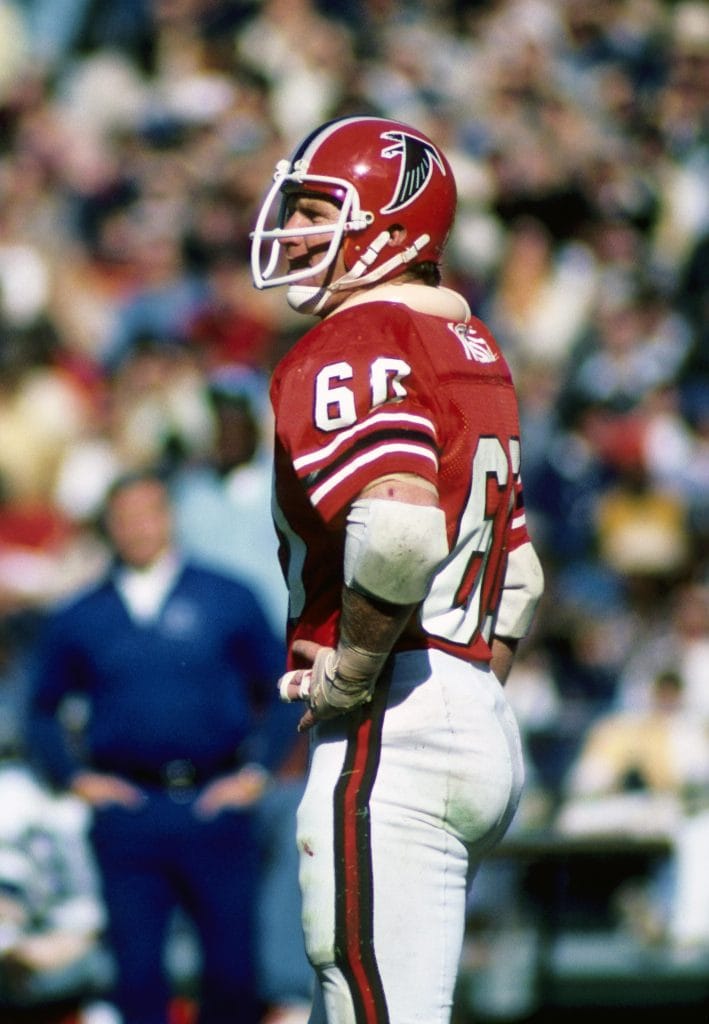 Tommy Nobis of the Atlanta Falcons, wearing jersey number 60, standing on the field during an NFL game.