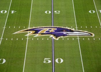 The Baltimore Ravens logo displayed at midfield, representing the legacy of the Top 10 Baltimore Ravens of All Time.