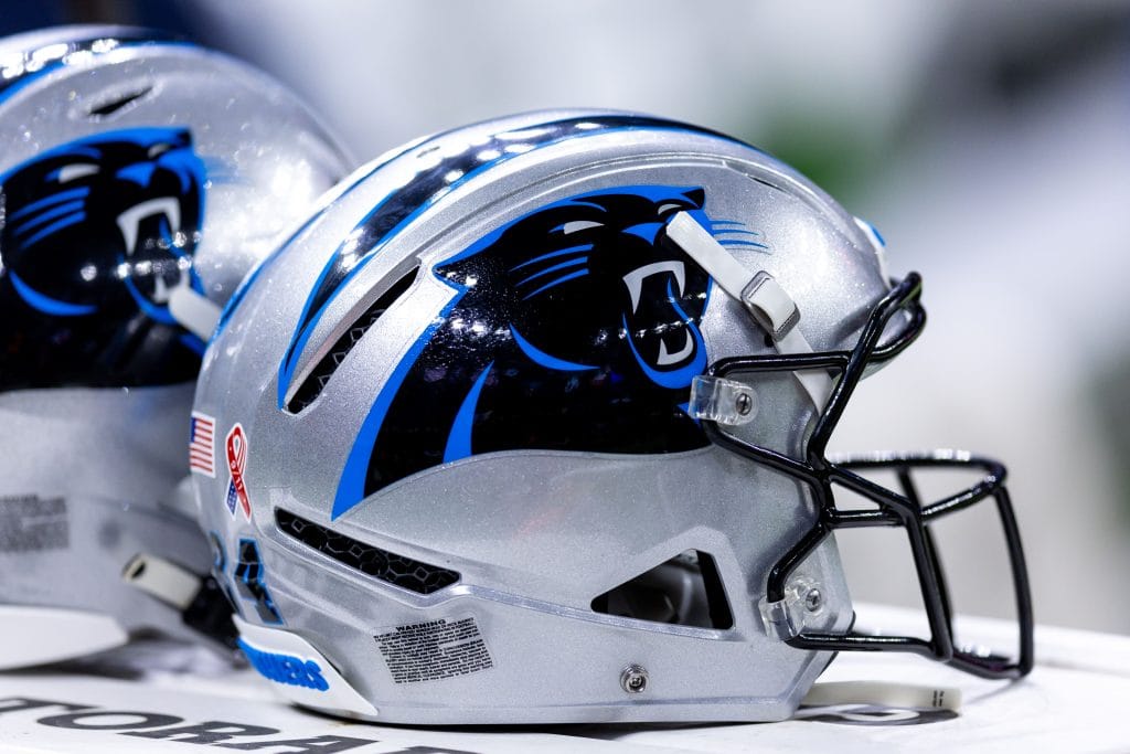 Two Carolina Panthers helmets representing Top 10 Carolina Panthers of All Time.