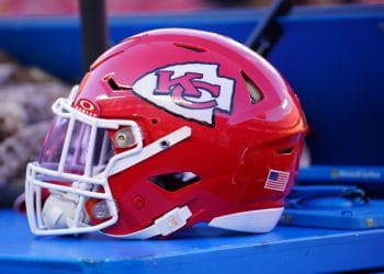 Close-up of a Kansas City Chiefs helmet on the sideline, representing the Top 10 Kansas City Chiefs of All Time and their iconic legacy.